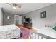 Spacious bedroom with two beds, hardwood floors, a ceiling fan, and neutral colored walls at 509 N Oak St, Lincolnton, NC 28092