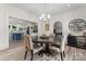 Elegant dining room featuring a round table, chandelier, and hardwood floors next to a gourmet kitchen at 509 N Oak St, Lincolnton, NC 28092