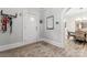 Inviting entryway featuring hardwood floors, a mirror, and view of the dining room at 509 N Oak St, Lincolnton, NC 28092