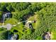 Aerial view of a home featuring a generous backyard, detached garage, and mature surrounding trees at 546 Little Cove Ln, Lake Wylie, SC 29710