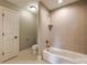 Bathroom with a shower and bathtub with tile surround, plus tile flooring at 546 Little Cove Ln, Lake Wylie, SC 29710