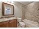 Cozy bathroom featuring granite counters and a shower-over-tub with stylish tile surround at 546 Little Cove Ln, Lake Wylie, SC 29710