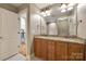 Bathroom with granite countertops, double vanity, and wood cabinets at 546 Little Cove Ln, Lake Wylie, SC 29710