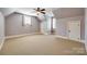 Bedroom with gray walls, carpet, ceiling fan, a dormer and two windows at 546 Little Cove Ln, Lake Wylie, SC 29710
