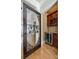 Butler's pantry featuring cabinetry, wine rack, beverage cooler, and hardwood flooring at 546 Little Cove Ln, Lake Wylie, SC 29710