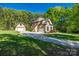 Charming two-story home with a well-manicured lawn and a long driveway leading to a garage at 546 Little Cove Ln, Lake Wylie, SC 29710