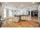 Spacious kitchen features white cabinets, stainless appliances, hardwood floors, and an open layout at 546 Little Cove Ln, Lake Wylie, SC 29710