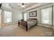 Large bedroom with trey ceiling, neutral carpet, and plenty of natural light at 546 Little Cove Ln, Lake Wylie, SC 29710