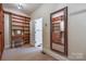 Walk-in closet with custom shelving and full-length mirror at 546 Little Cove Ln, Lake Wylie, SC 29710