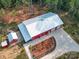 Aerial view of red barn style home and surrounding grounds at 574 Crescent Rd, Rockwell, NC 28138