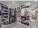 Walk-in closet with custom shelving and storage, including a view of a nearby bathroom at 574 Crescent Rd, Rockwell, NC 28138