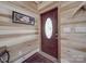 Charming entryway with wood paneling and decorative front door at 574 Crescent Rd, Rockwell, NC 28138