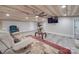 Living room featuring a beamed ceiling with a ceiling fan, hardwood floors, and a sofa at 574 Crescent Rd, Rockwell, NC 28138
