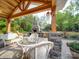 Inviting outdoor patio area with a fireplace and comfortable seating for relaxing and entertaining at 574 Crescent Rd, Rockwell, NC 28138