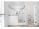 Bright bathroom features a glass enclosed shower with decorative tile work at 6206 Glencairn Ct, Charlotte, NC 28269