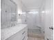 Bright bathroom featuring a glass shower with tiled walls, chrome fixtures, and a marble vanity at 6206 Glencairn Ct, Charlotte, NC 28269