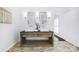 Bathroom vanity with double sinks, decorative mirrors, and sconce lighting at 6206 Glencairn Ct, Charlotte, NC 28269
