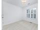 Bright bedroom featuring a large window with plantation shutters and neutral carpet at 6206 Glencairn Ct, Charlotte, NC 28269