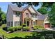 Beautiful two-story home featuring lush landscaping, neutral paint, and an attached two-car garage at 6206 Glencairn Ct, Charlotte, NC 28269