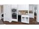 Kitchen with built-in oven, microwave, wine cooler, and decorative backsplash at 6206 Glencairn Ct, Charlotte, NC 28269