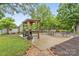 Cozy backyard featuring a grill and dining table with a basketball hoop perfect for entertaining at 632 Skyland N Dr, Mount Pleasant, NC 28124