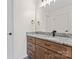 Bathroom featuring granite countertops, black hardware and black faucet and white cabinets at 632 Skyland N Dr, Mount Pleasant, NC 28124