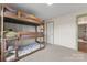 Bedroom with carpet flooring, triple bunk beds and green trim at 632 Skyland N Dr, Mount Pleasant, NC 28124