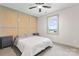 Bedroom featuring a queen bed with light gray linens, gray nightstands, and neutral carpet at 632 Skyland N Dr, Mount Pleasant, NC 28124