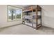 bedroom with triple bunk beds next to a window with views of the outdoors at 632 Skyland N Dr, Mount Pleasant, NC 28124