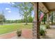 Cozy front porch with brick accents, and view of a lush, green lawn at 632 Skyland N Dr, Mount Pleasant, NC 28124