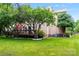 Expansive backyard showcasing lush greenery, a wooden deck, and mature trees offering shade and privacy at 6432 Morningsong Ln, Charlotte, NC 28269