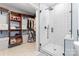 Open bathroom view showing a spacious closet and a glass-door shower at 6432 Morningsong Ln, Charlotte, NC 28269