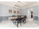 Elegant dining room with modern light fixture and stylish wall decor at 6432 Morningsong Ln, Charlotte, NC 28269