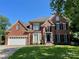 Charming brick home with well-manicured lawn, attached garage and inviting entrance at 6432 Morningsong Ln, Charlotte, NC 28269