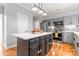 Modern kitchen with a large island, stainless steel appliances, and gray cabinetry at 6432 Morningsong Ln, Charlotte, NC 28269