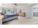 Bright main bedroom with a tray ceiling, neutral paint, and three windows at 6432 Morningsong Ln, Charlotte, NC 28269