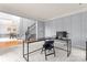 Functional office space with grid-paneled walls and views of the staircase at 6432 Morningsong Ln, Charlotte, NC 28269