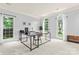 Bright and airy office featuring large windows and neutral color palette at 6432 Morningsong Ln, Charlotte, NC 28269