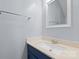 Bathroom vanity features a blue cabinet and modern fixtures, complemented by a stylish towel rack at 6443 Mallard View Ln, Charlotte, NC 28269
