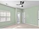 Comfortable bedroom with a ceiling fan and natural light at 6443 Mallard View Ln, Charlotte, NC 28269