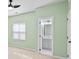 Inviting bedroom with natural light, ceiling fan, and an ensuite bathroom at 6443 Mallard View Ln, Charlotte, NC 28269