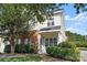 Well-maintained two-story home with brick accents, manicured bushes and a neatly kept front lawn at 6443 Mallard View Ln, Charlotte, NC 28269