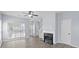 Bright, open living room features wood floors, fireplace, ample natural light, and neutral paint at 6443 Mallard View Ln, Charlotte, NC 28269
