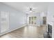 Spacious living area with wood floors, large windows, and an open layout, perfect for entertaining at 6443 Mallard View Ln, Charlotte, NC 28269
