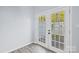 Bright room with doors leading to a private outdoor space at 6443 Mallard View Ln, Charlotte, NC 28269