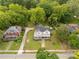 Scenic aerial view of a two-story home with a classic design nestled amongst mature trees and verdant lawns at 7 Kings Mountain St, York, SC 29745