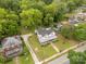 High-angle shot showcases a charming home, complete with a well-kept yard, mature trees, and neighborhood landscape at 7 Kings Mountain St, York, SC 29745