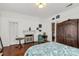 Spacious bedroom with decorative fireplace, hardwood floors, and vintage-style furniture at 7 Kings Mountain St, York, SC 29745