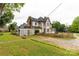 A beautiful home with a fenced yard and a lovely garden area that enhances the outdoor appeal at 7 Kings Mountain St, York, SC 29745