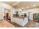 Updated kitchen with an island, butcher block counters, and views into adjoining rooms at 7 Kings Mountain St, York, SC 29745